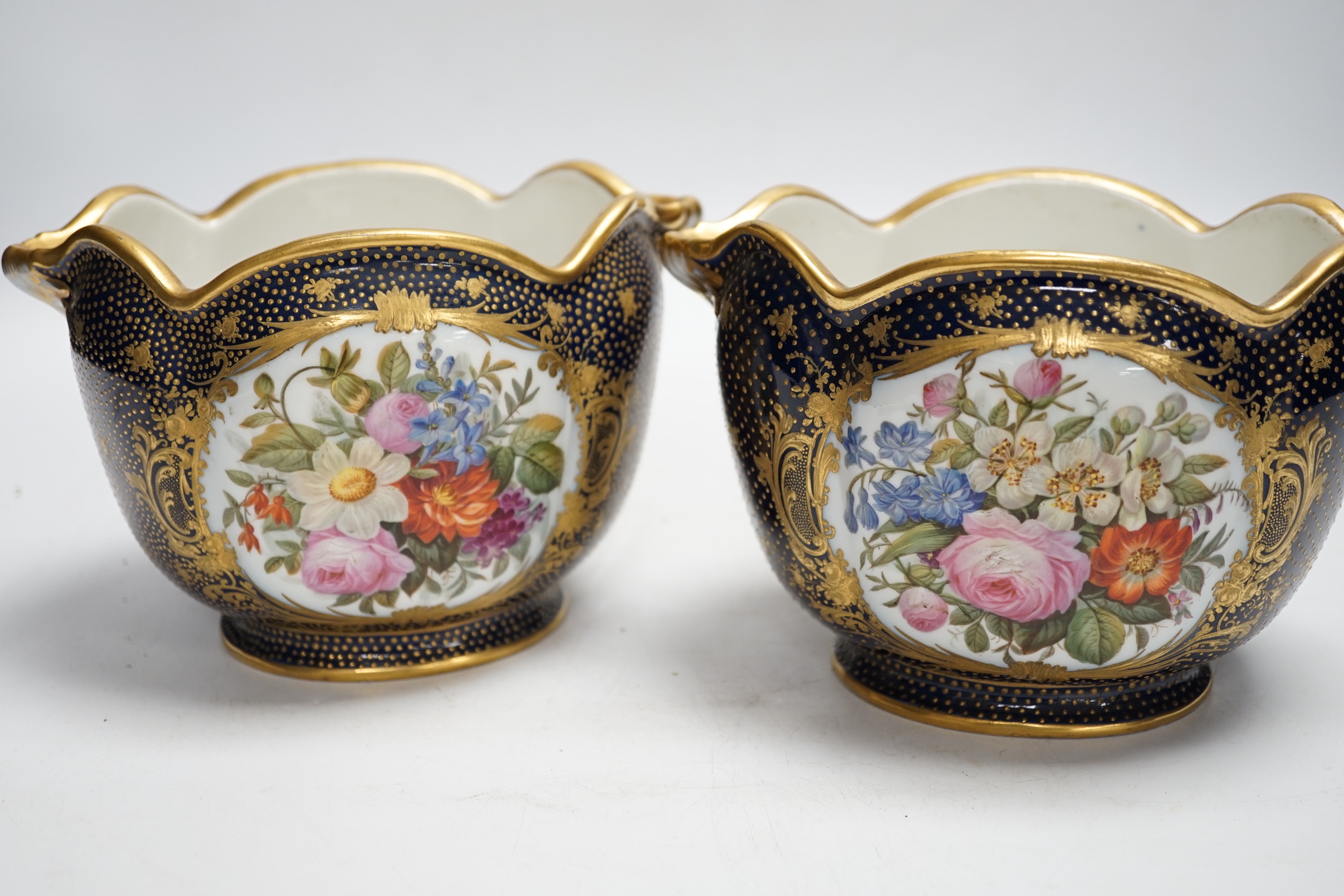 A pair of 19th century Paris porcelain cache pot hand painted with flowers and gilded decoration, 12cm high